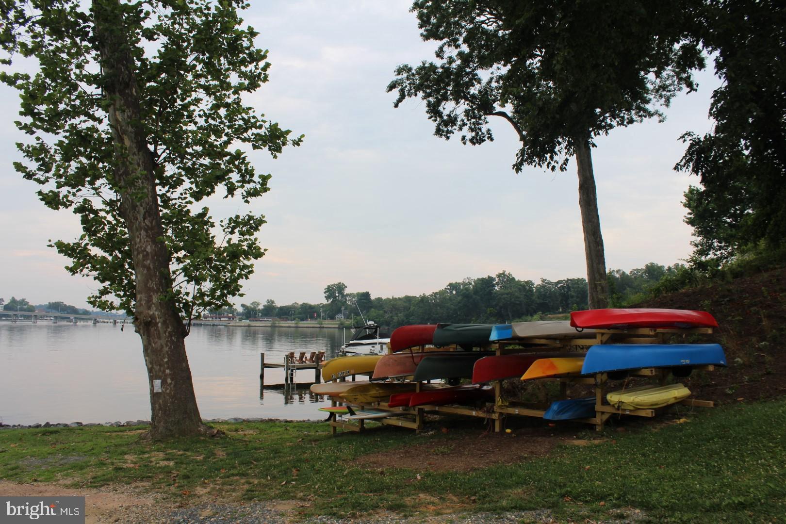 404 Paradise Road Riva, MD 21140 - Photo 45 of 51 a roof deck with table and chairs under an umbrella