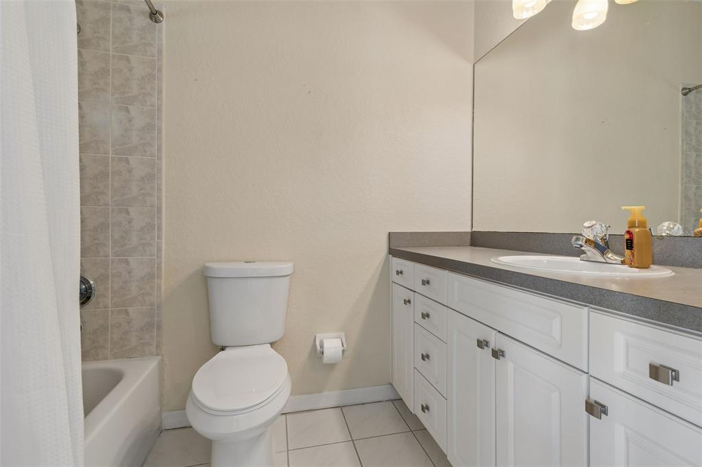 703 Bunker View Drive Apollo Beach, FL 33572 - Photo 37 of 49 a bathroom with a granite countertop toilet and sink