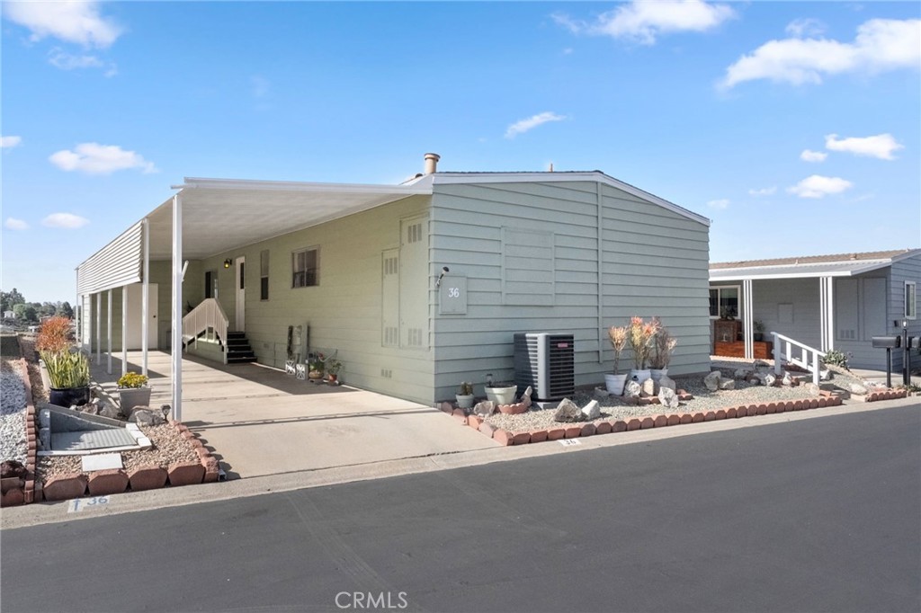 1195 La Moree Road, Unit 36 San Marcos, CA 92078 - Photo 2 of 47 a view of a house with dining area and chandelier