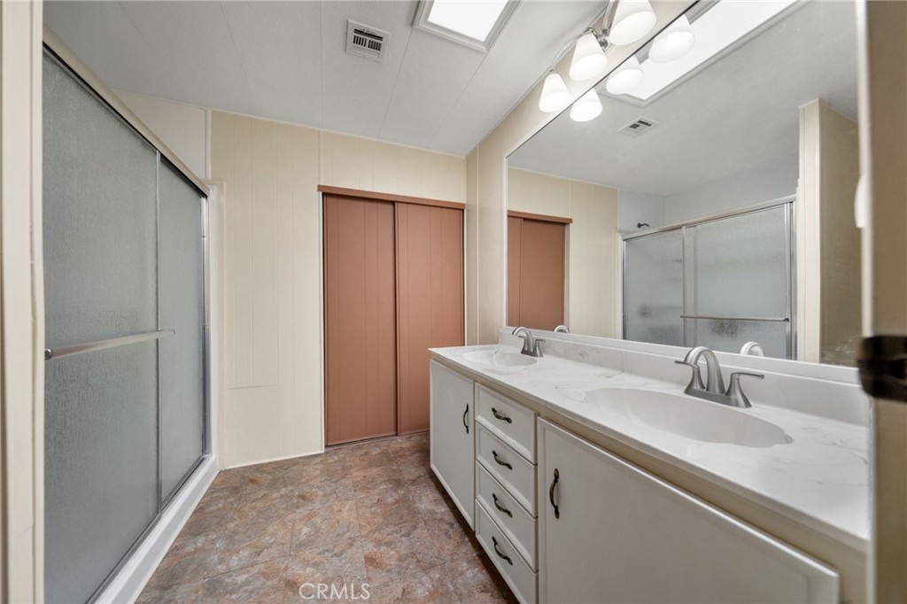 1195 La Moree Road, Unit 36 San Marcos, CA 92078 - Photo 21 of 47 a bathroom with a sink double vanity and a mirror