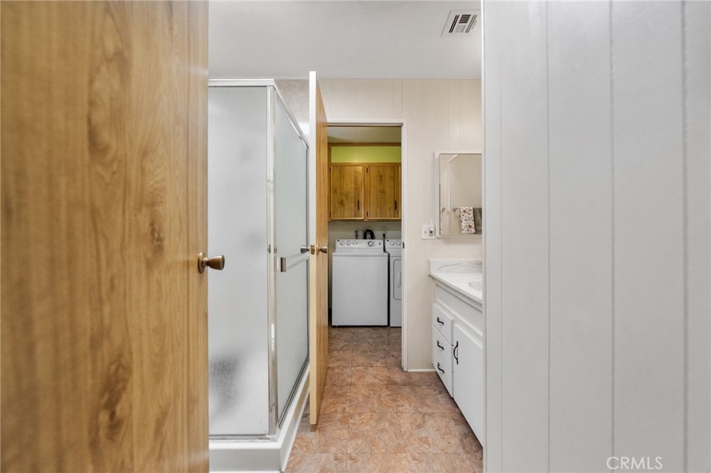 1195 La Moree Road, Unit 36 San Marcos, CA 92078 - Photo 24 of 47 a bathroom with a double vanity sink and mirror