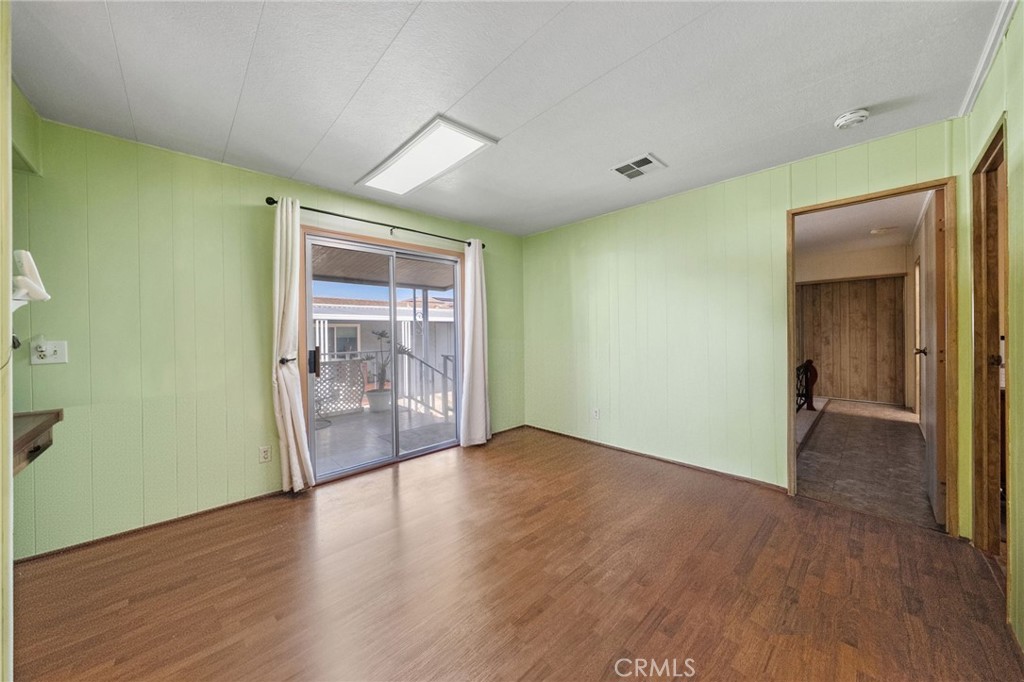 1195 La Moree Road, Unit 36 San Marcos, CA 92078 - Photo 29 of 47 an empty room with wooden floor and windows