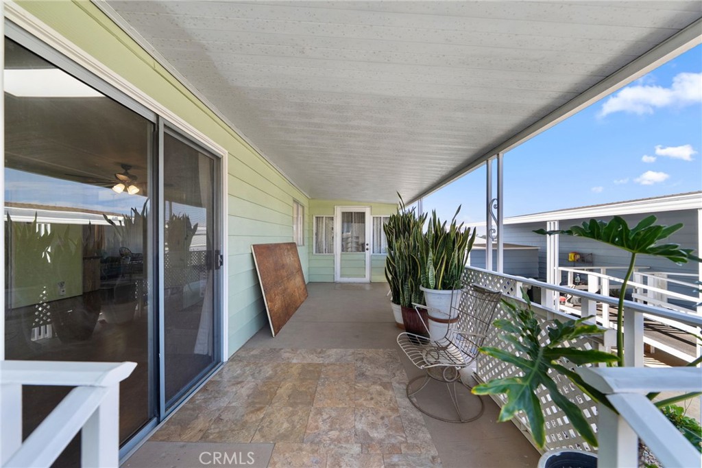 1195 La Moree Road, Unit 36 San Marcos, CA 92078 - Photo 32 of 47 a view of a porch with chairs and potted plants