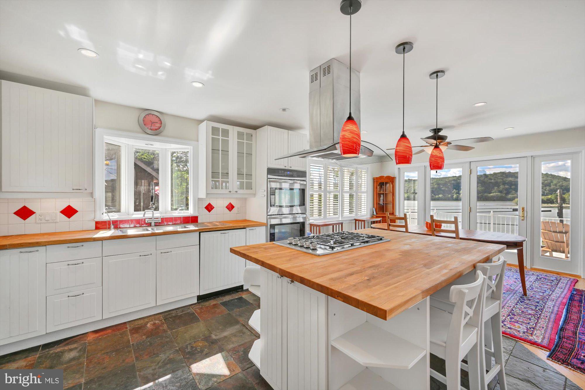 689 Bridge Valley Road Pequea, PA 17565 - Photo 10 of 42 a view of a kitchen with kitchen island stainless steel appliances and wooden floor