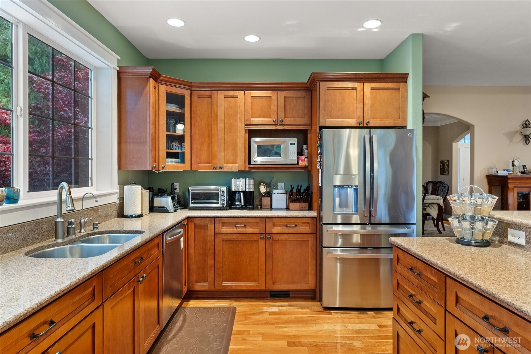 6205 139th Lane Southwest Rochester, WA 98579 - Photo 11 of 39 a kitchen with stainless steel appliances granite countertop a refrigerator and a sink