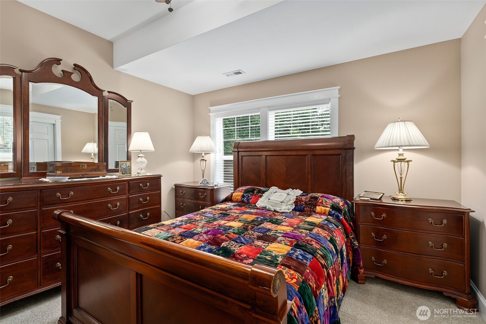 6205 139th Lane Southwest Rochester, WA 98579 - Photo 23 of 39 a bedroom with a bed and dresser with mirror
