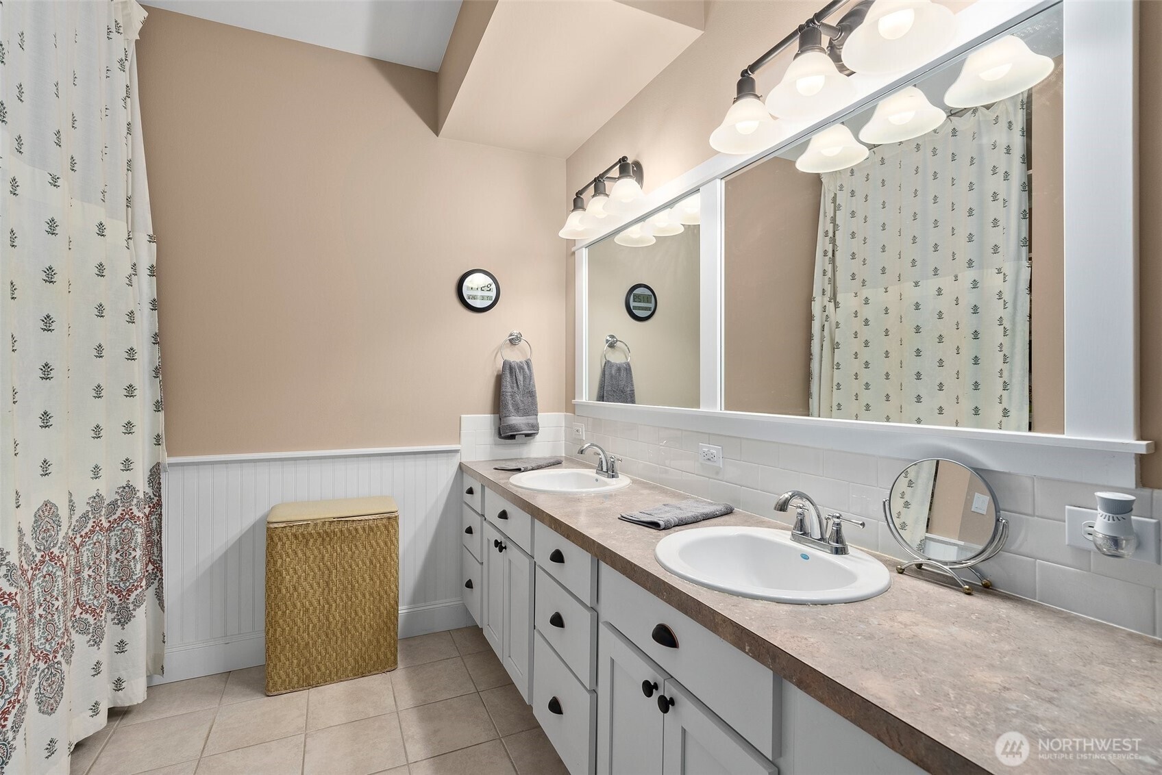 6205 139th Lane Southwest Rochester, WA 98579 - Photo 24 of 39 a bathroom with a granite countertop sink and a mirror