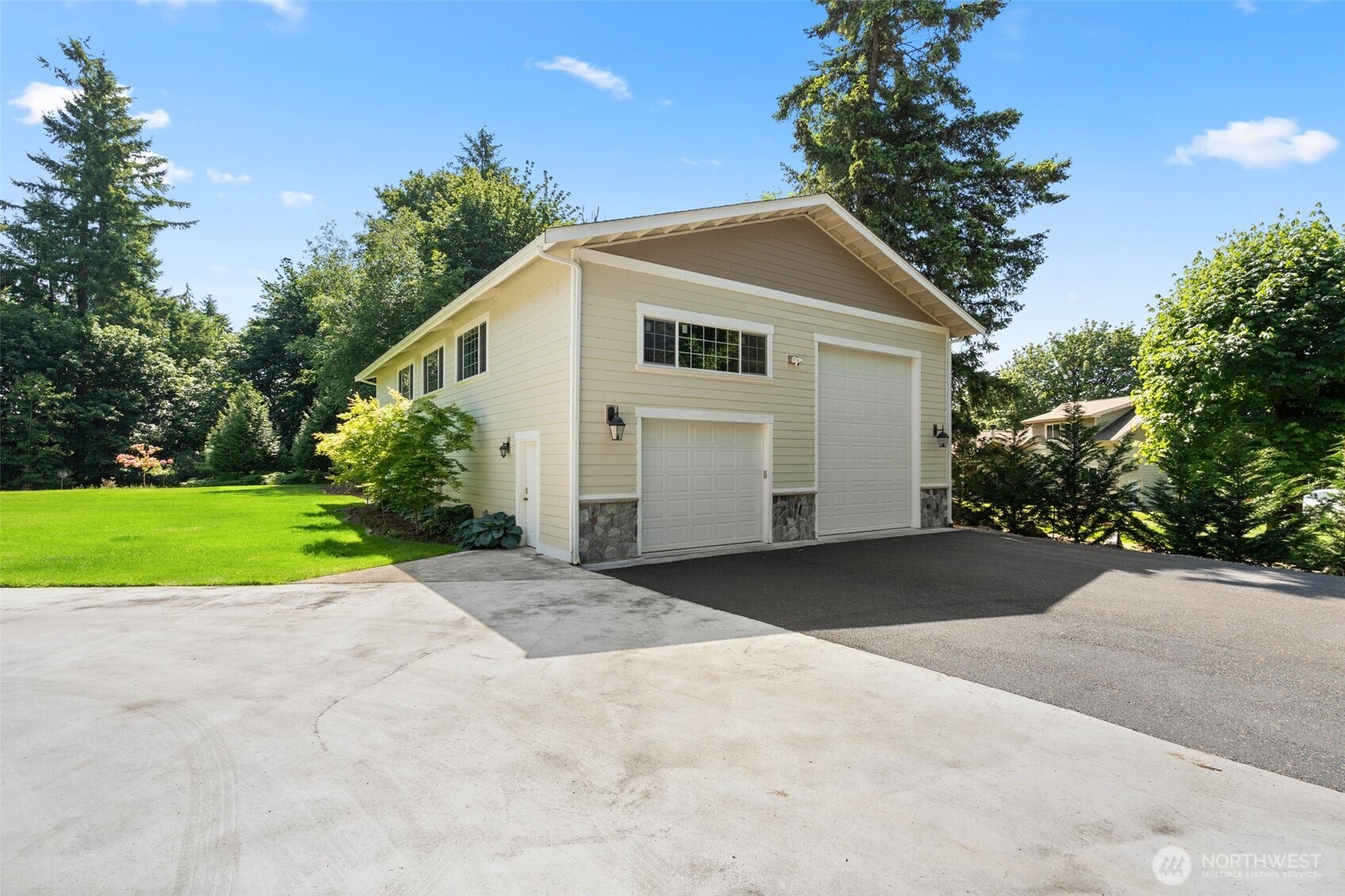 6205 139th Lane Southwest Rochester, WA 98579 - Photo 33 of 39 a view of a house with a yard and garage
