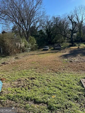 a view of a yard with an trees