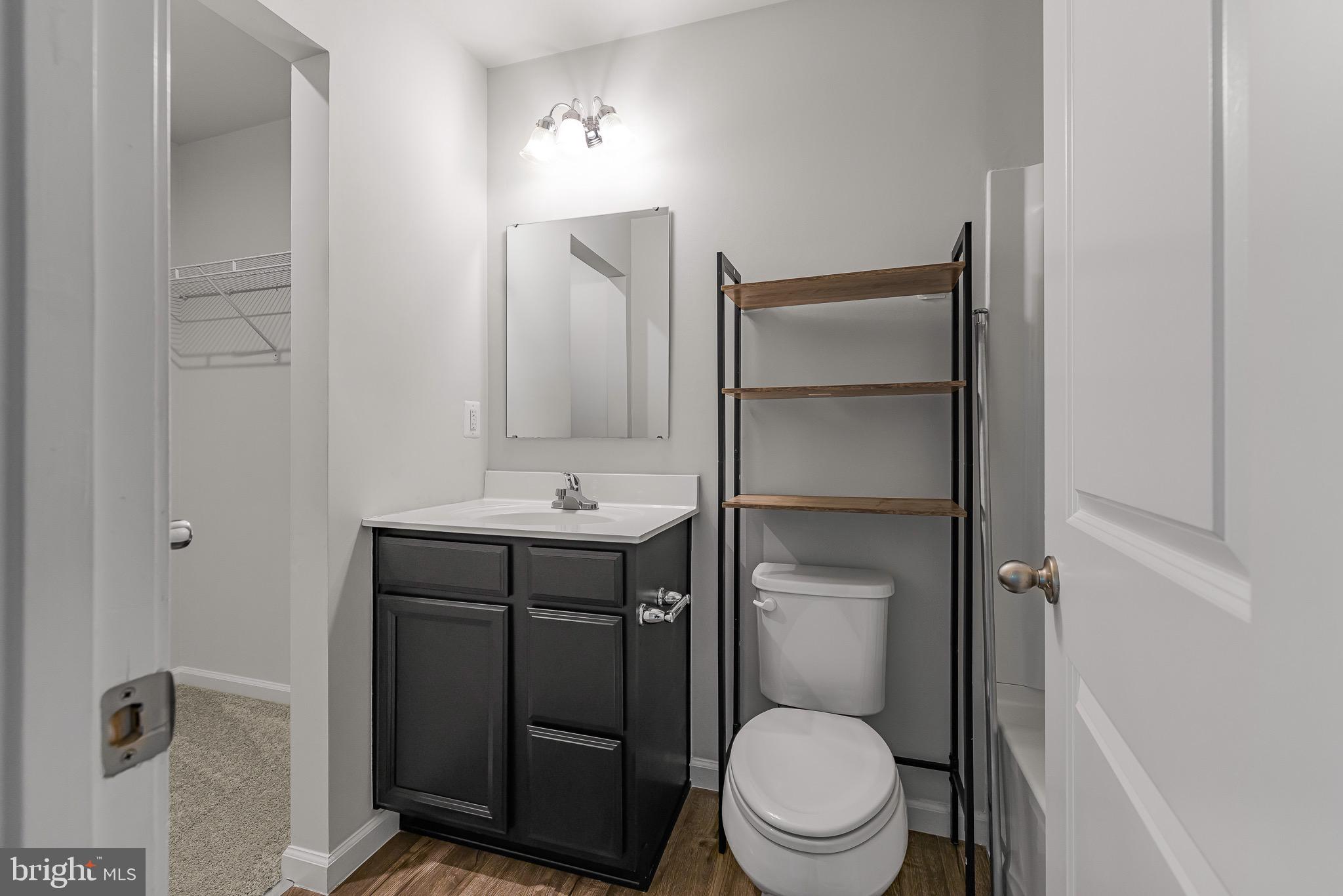 112 Azalea Circle Elkton, MD 21921 - Photo 26 of 34 a bathroom with a toilet a sink and mirror