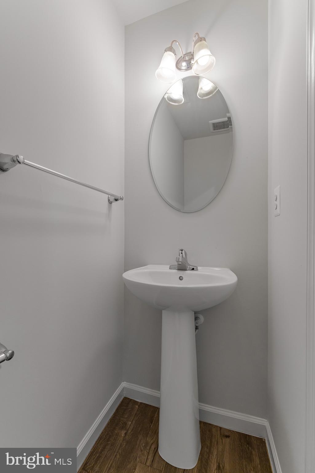 112 Azalea Circle Elkton, MD 21921 - Photo 10 of 34 a bathroom with a sink toilet and a mirror