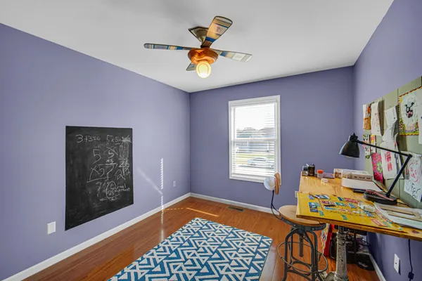 a bedroom with furniture and a window