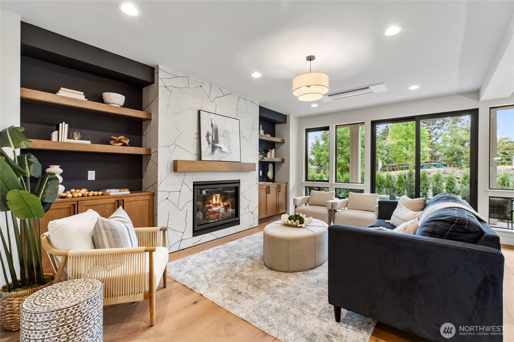 1504 3rd Street Kirkland, WA 98033 - Photo 12 of 36 a living room with furniture and a fireplace