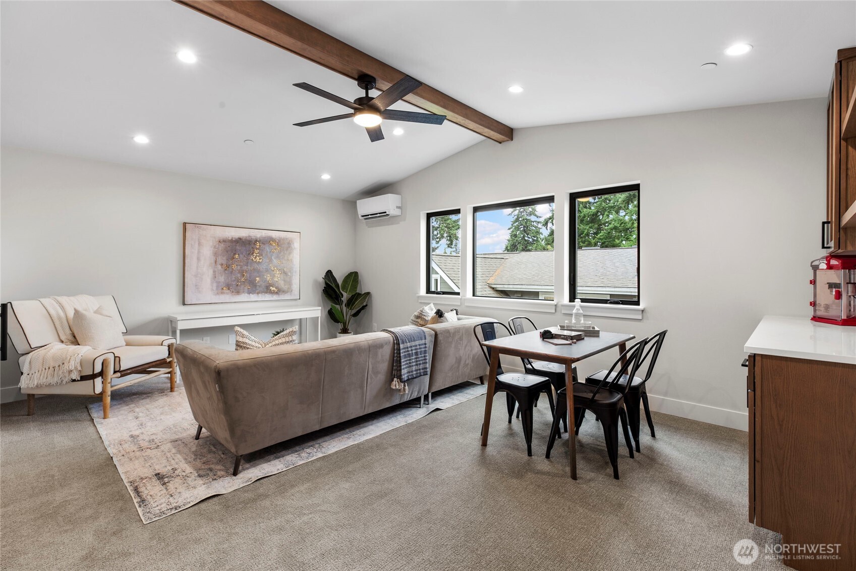 1504 3rd Street Kirkland, WA 98033 - Photo 26 of 36 a living room with furniture a large window and a table