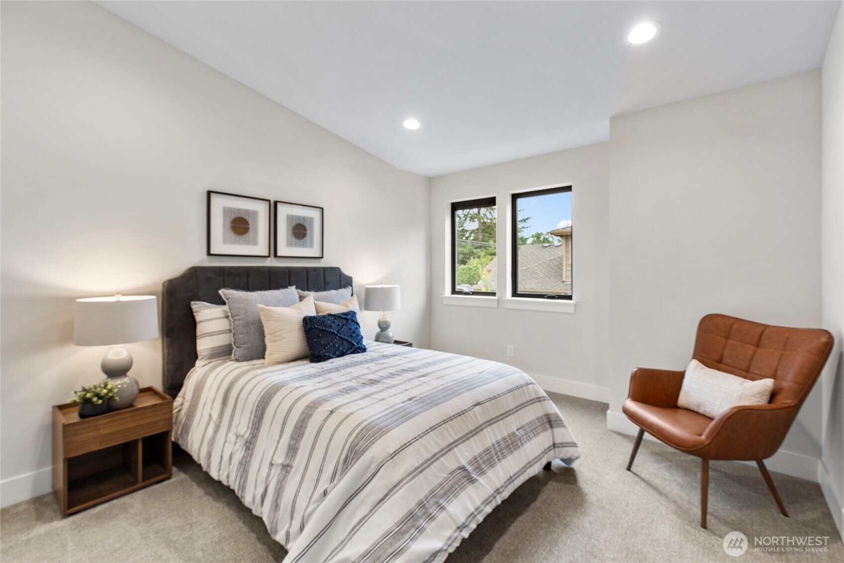 1504 3rd Street Kirkland, WA 98033 - Photo 30 of 36 a bedroom with a bed and a chair