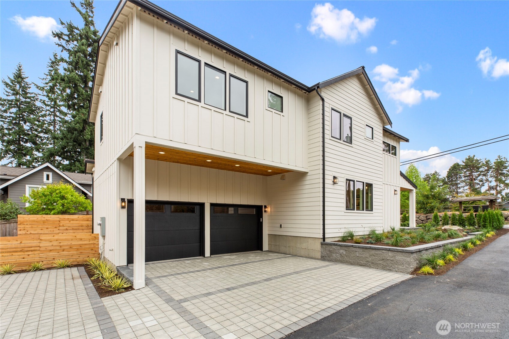 1504 3rd Street Kirkland, WA 98033 - Photo 36 of 36 a front view of a house with a yard and garage