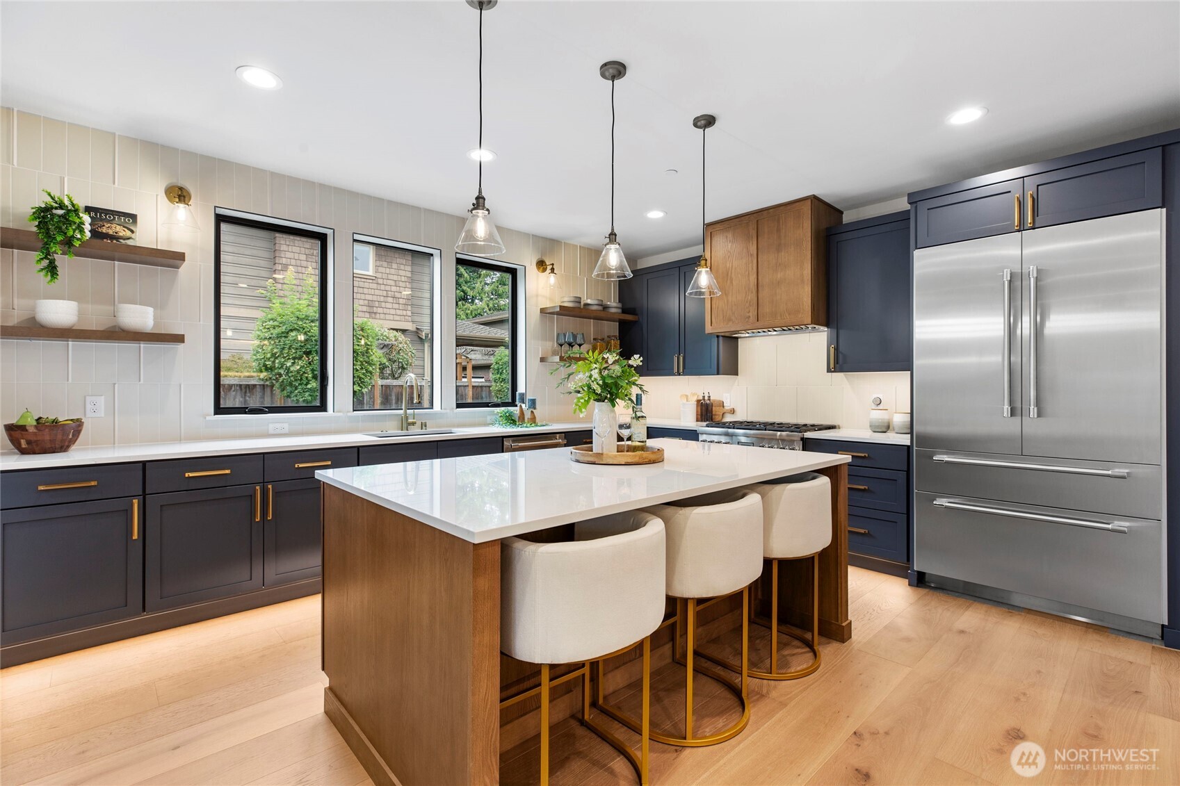 1504 3rd Street Kirkland, WA 98033 - Photo 8 of 36 a kitchen with stainless steel appliances granite countertop a sink a stove and a refrigerator