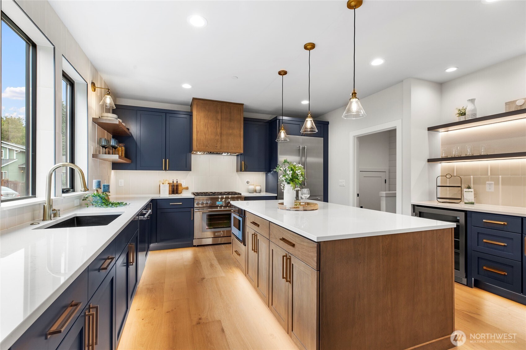 1504 3rd Street Kirkland, WA 98033 - Photo 10 of 36 a kitchen with kitchen island a stove a sink a refrigerator a center island a stove and a center island