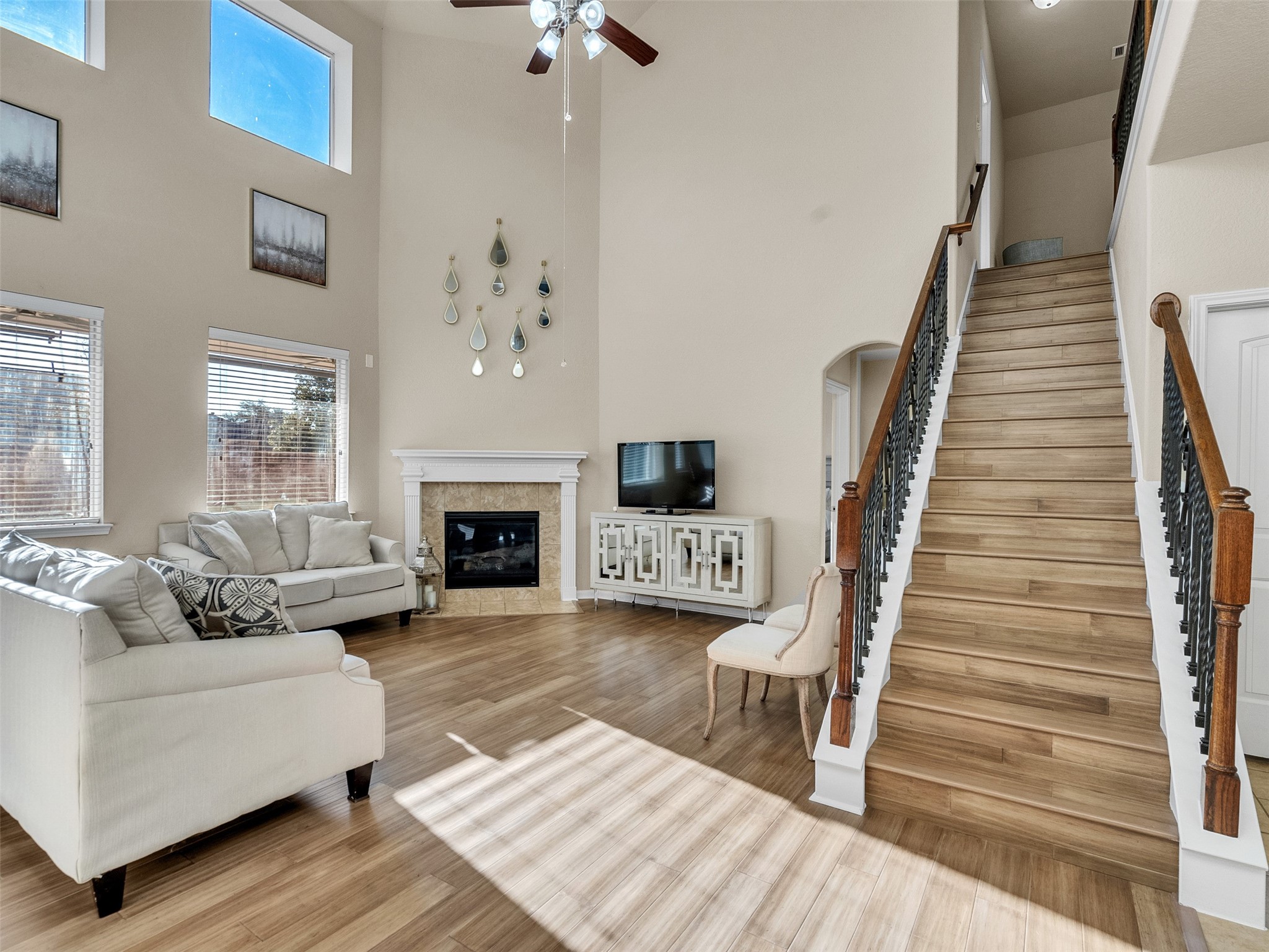 522 Summer Mist Lane Rosenberg, TX 77469 - Photo 2 of 36 This stunning two-story living room is the heart of the home, featuring soaring ceilings and an abundance of natural light that creates an open, airy sanctuary.