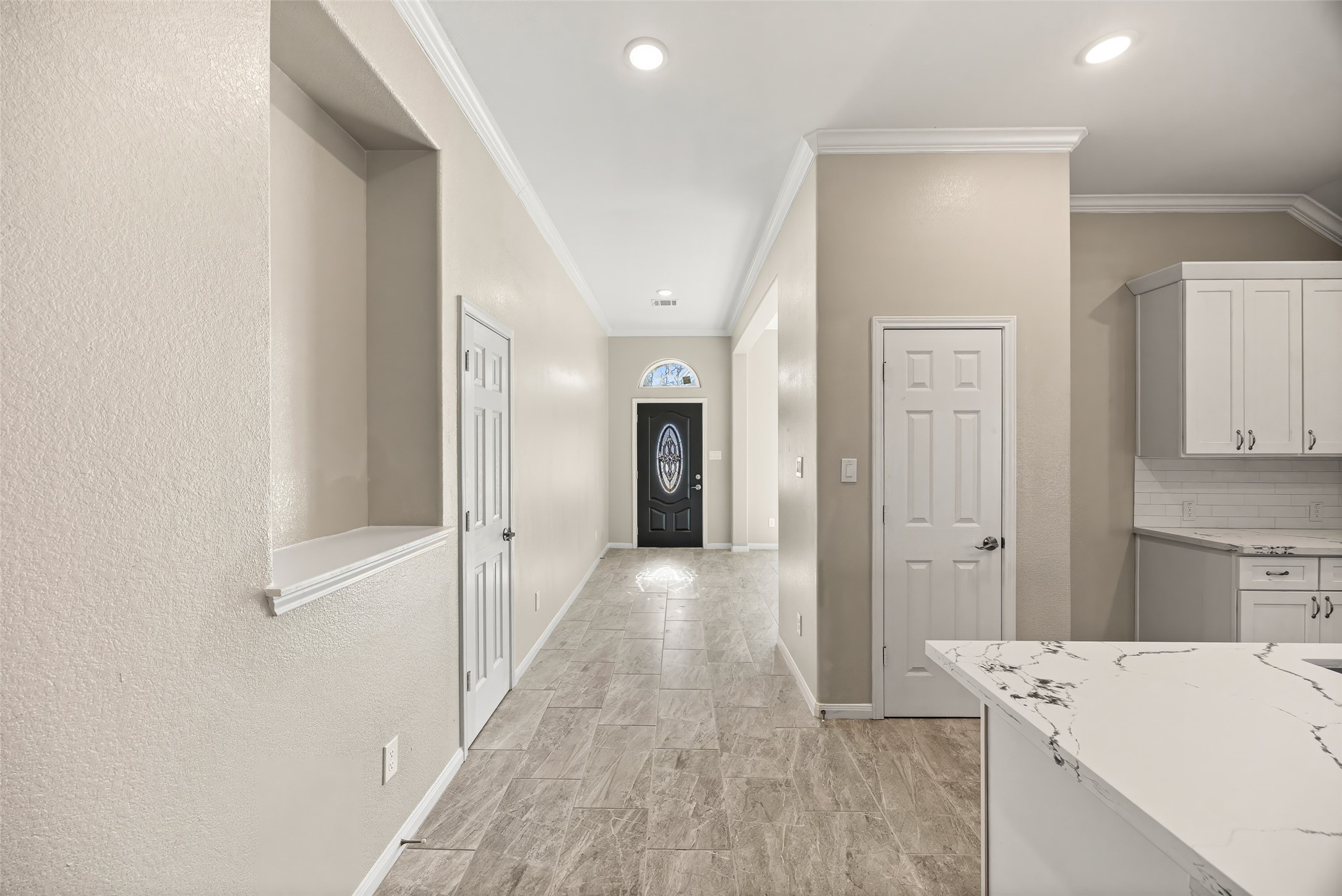 710 Hackberry Street La Marque, TX 77568 - Photo 8 of 41 a view of a hallway with wooden floor and cabinets