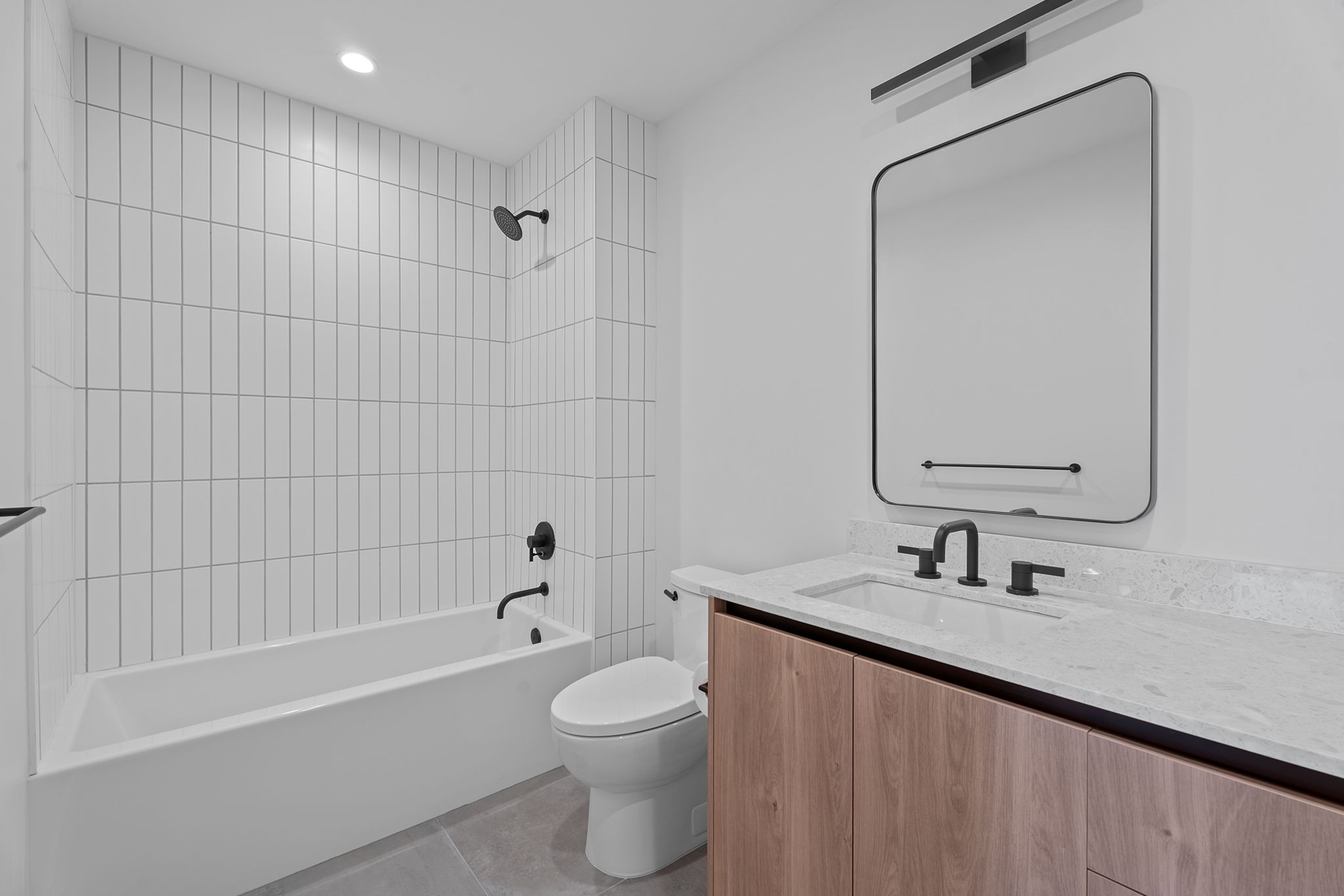 84 East Avenue, Unit 3401 Austin, TX 78701 - Photo 22 of 40 a bathroom with a sink a toilet and shower