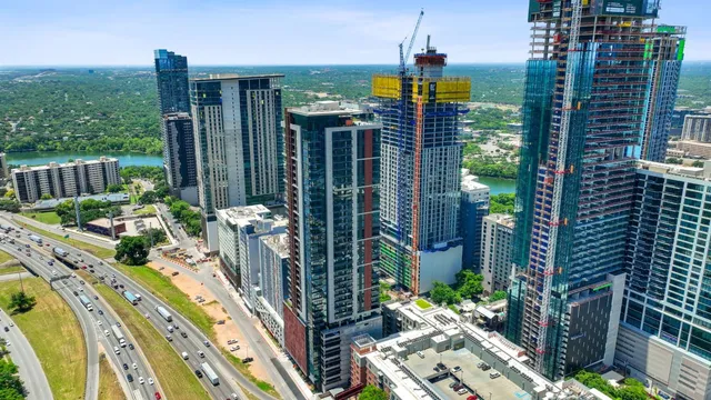 a view of a chairs and table in the balcony