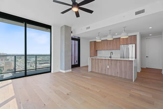 a view of a kitchen with a sink and a window