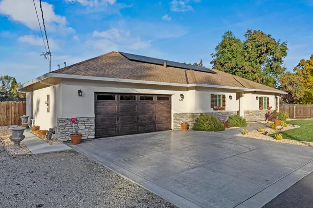 a view of a street with an outdoor seating