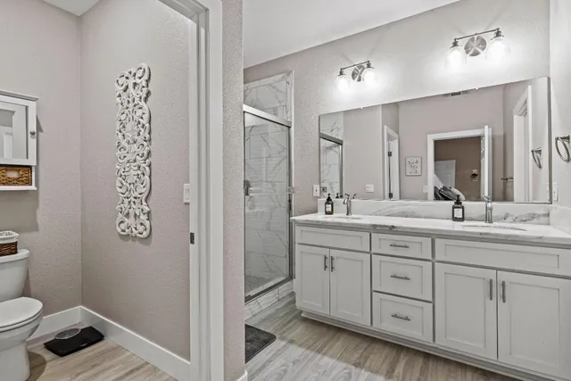 a room with furniture a flat screen tv and a window