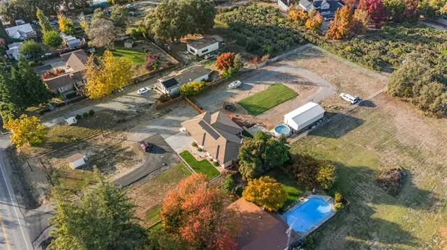 a view of a swimming pool and a yard
