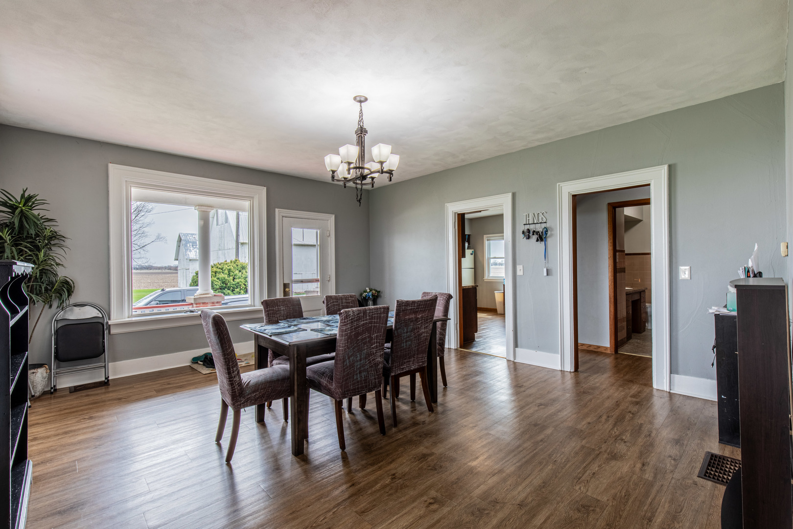 16606 West Backbone Road Princeton, IL 61356 - Photo 12 of 40 a view of a dining room with furniture window and wooden floor