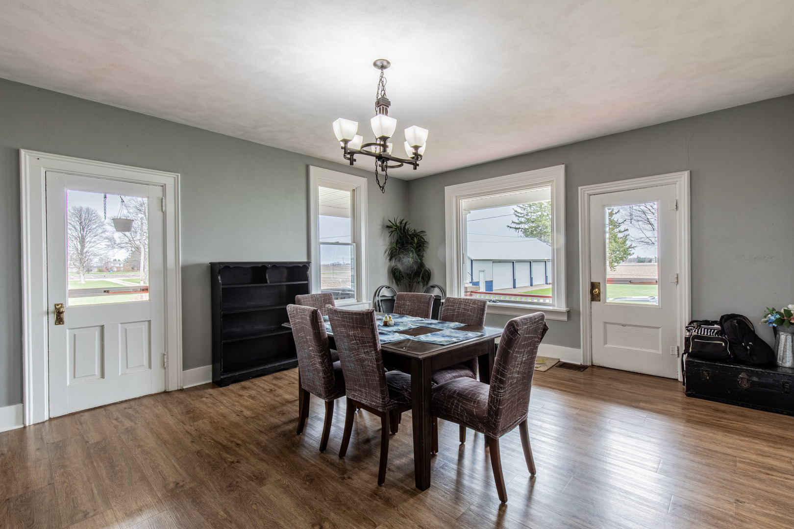 16606 West Backbone Road Princeton, IL 61356 - Photo 14 of 40 a view of a dining room with furniture window and wooden floor