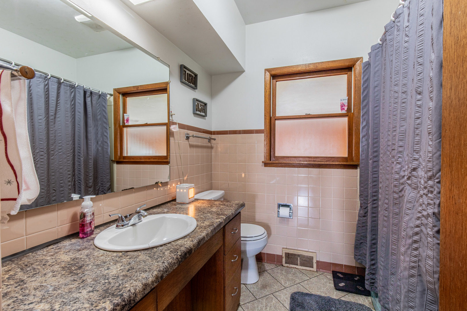 16606 West Backbone Road Princeton, IL 61356 - Photo 17 of 40 a bathroom with a granite countertop sink and a mirror