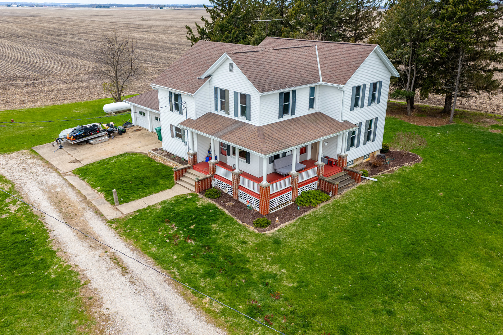 16606 West Backbone Road Princeton, IL 61356 - Photo 2 of 40 a aerial view of a house with a yard table and chairs