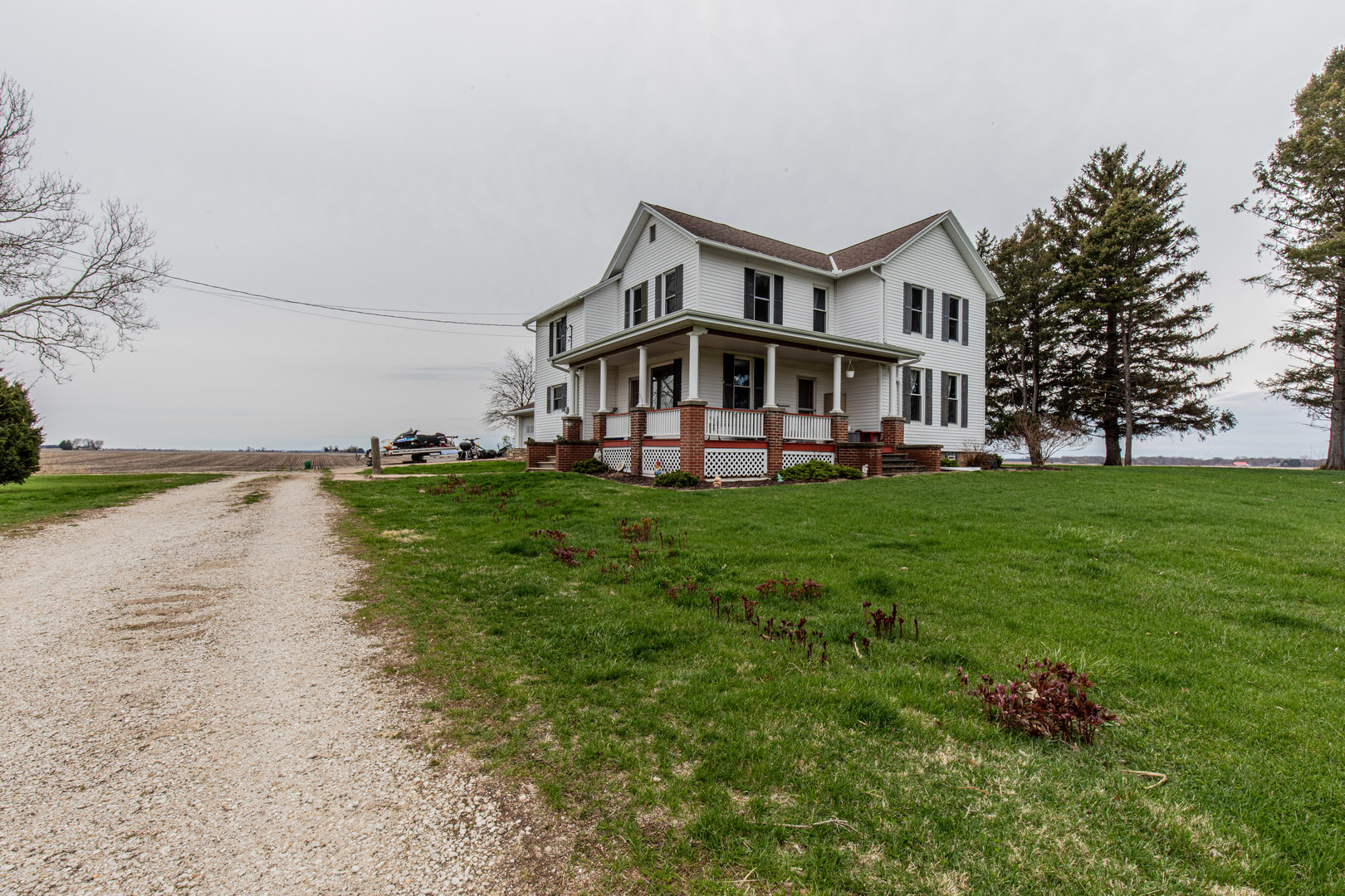 16606 West Backbone Road Princeton, IL 61356 - Photo 7 of 40 a view of a house with a big yard and large trees