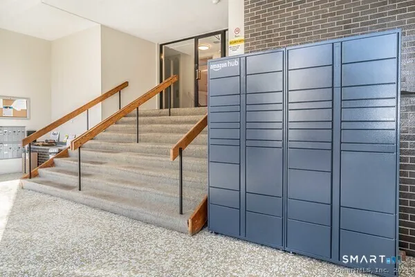 a kitchen with granite countertop stainless steel appliances and wooden cabinets