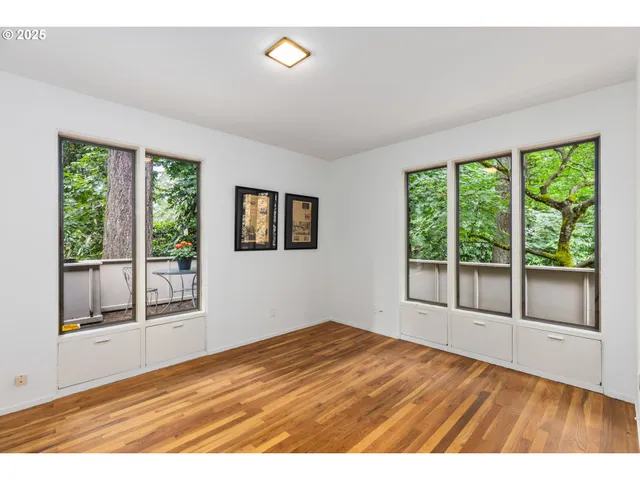 a view of a room with wooden floor and floor