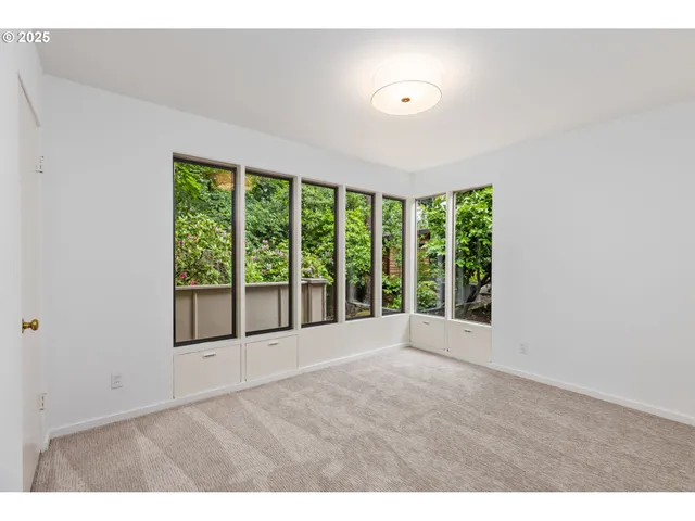 a bathroom with a sink vanity granite tub shower and a mirror