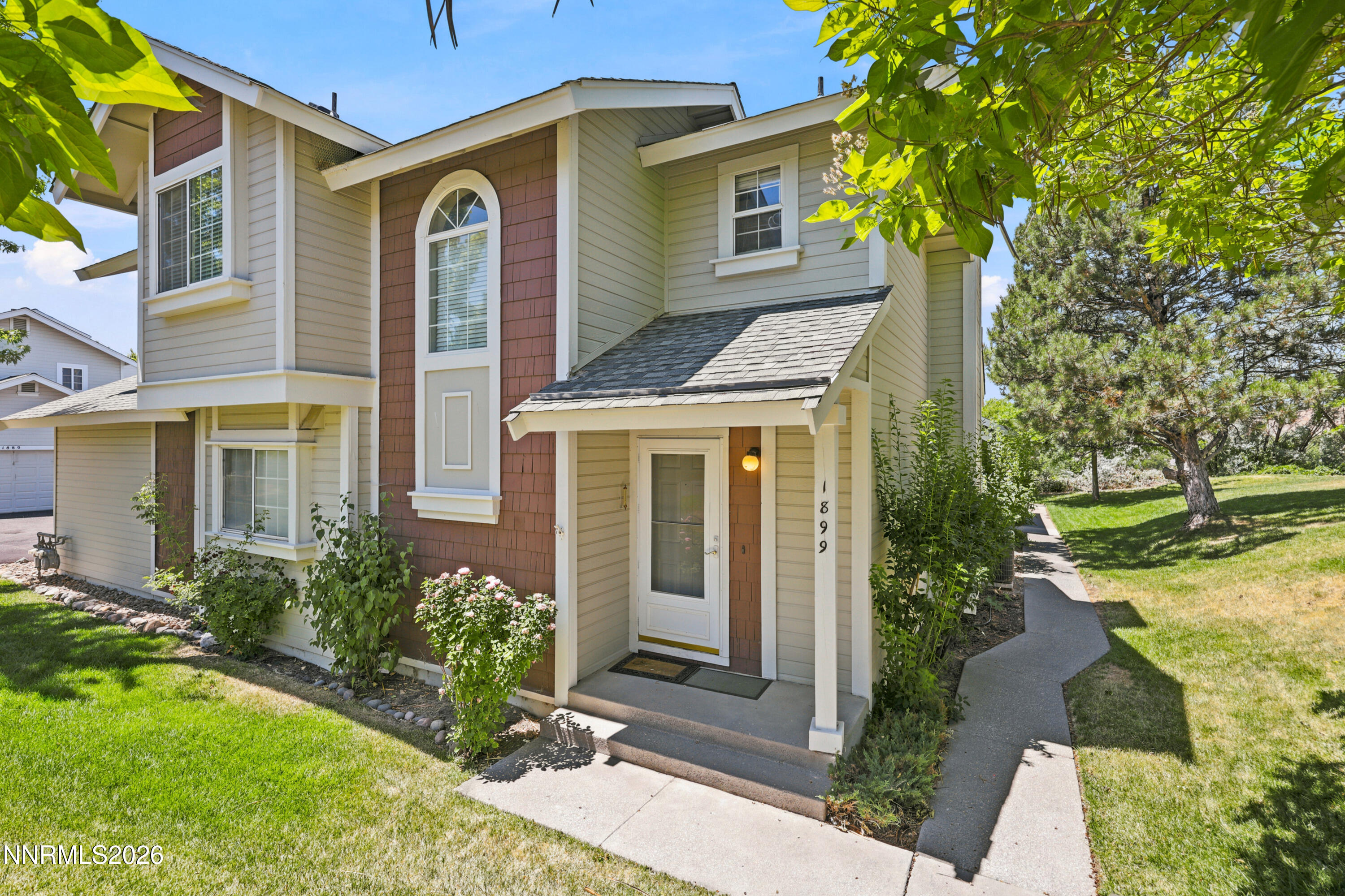 1899 Tuolumne Drive Reno, NV 89523 - Photo 1 of 44 a front view of a house with a yard