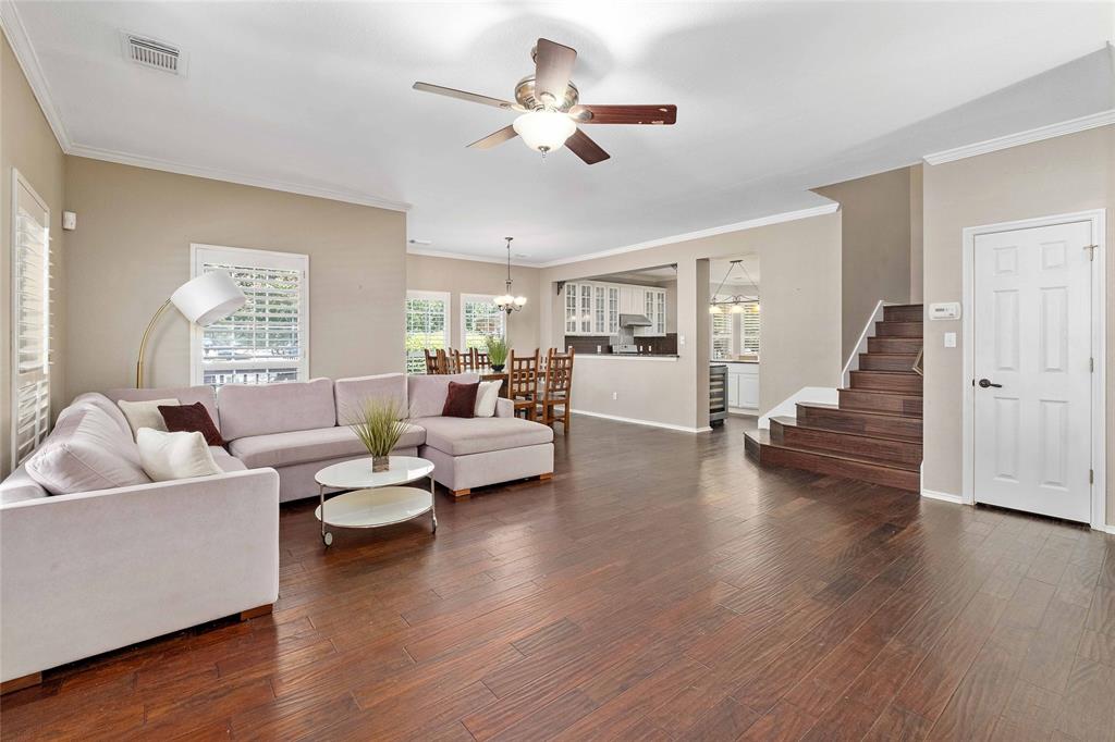 2730 Kinney Oaks Court Austin, TX 78704 - Photo 5 of 32 Spacious, light-filled living room flows seamlessly into the dining area, with an open view of the kitchen.