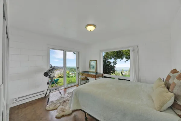 a bed room with furniture and a window