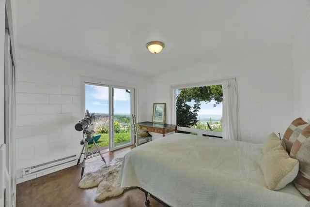 a bed room with furniture and a window