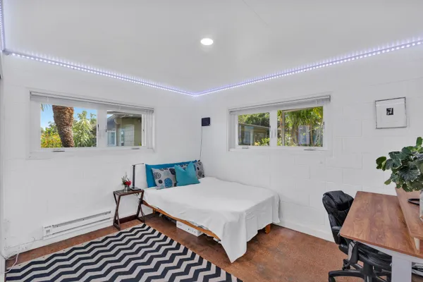 a bedroom with a bed and a table in it