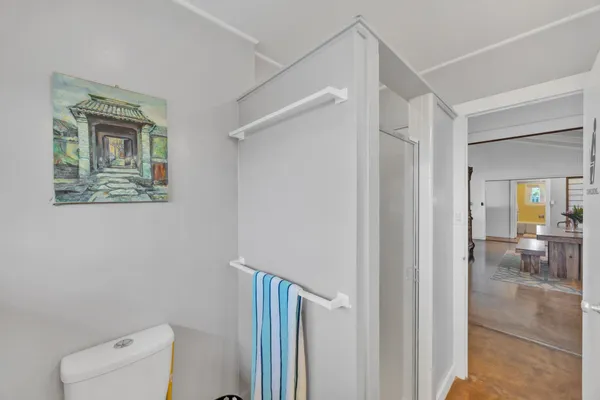a view of hallway with livingroom and furniture