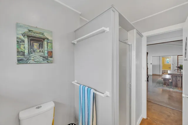 a view of hallway with livingroom and furniture