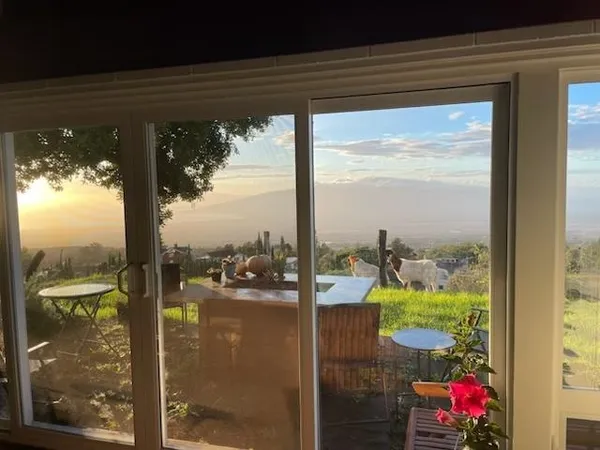 a view of a backyard with sitting area