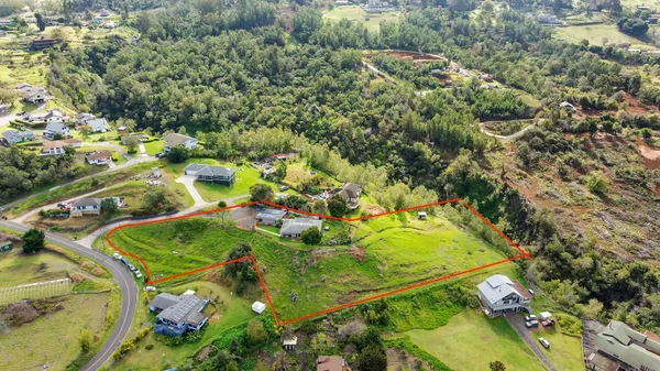 a view of a porch with furniture and a yard