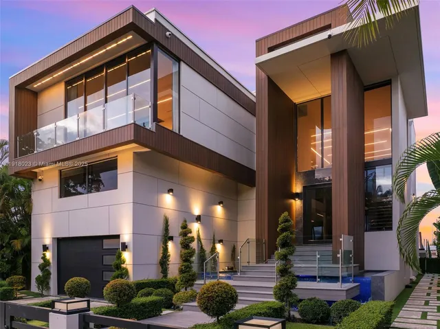 a front view of a building with a glass door and outdoor space