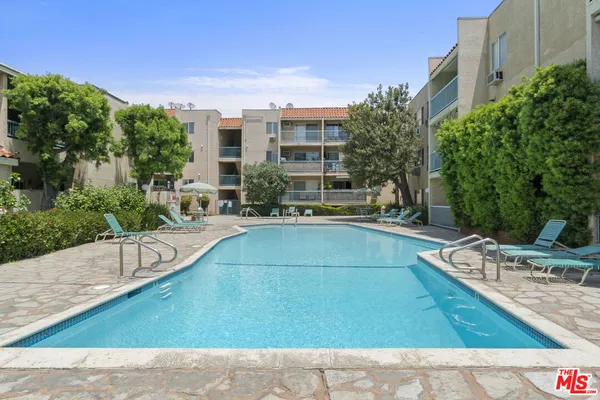 a view of a swimming pool with a patio