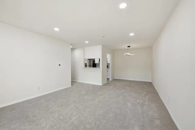 a view of a kitchen with a microwave and a refrigerator